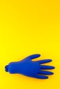 Inflated sterile medical gloves on a yellow background