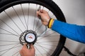 Inflating a bicycle wheel Royalty Free Stock Photo