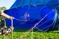 Inflating of a blue aerostat Royalty Free Stock Photo