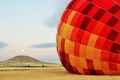 Inflating Hot Air Balloon in Vivid Color. Royalty Free Stock Photo