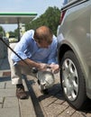 Inflating a tire Royalty Free Stock Photo