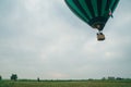 Inflating, unpack and flying up hot air balloon watermelon. Burner directing flame into envelope. Take off aircraft fly Royalty Free Stock Photo