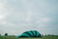 Inflating, unpack and flying up hot air balloon watermelon. Burner directing flame into envelope. Take off aircraft fly Royalty Free Stock Photo