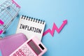 Inflation and consumer price increasing concept with pink purse, calculator and shopping cart Royalty Free Stock Photo