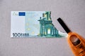 Inflation and depreciation money, concept. Bankruptcy or financial ruin and poverty. Burnt Euro banknote and lighter Royalty Free Stock Photo