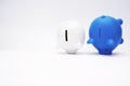 Inflation and devaluation concepts - Blue White Piggy Bank against white wall background