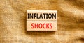 Inflation shocks symbol. Concept words Inflation shocks on wooden blocks. Beautiful canvas table canvas background. Business