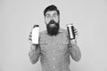 Influencer beauty blogger reviewing bath cosmetics. Bath soap. Bath cosmetics review. Man bearded hipster hold plastic