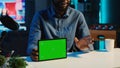 Influencer films green screen tablet