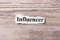 Influencer of the word on paper. concept. Words of influencer on a wooden background Royalty Free Stock Photo