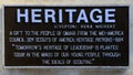 Info plaque for \'Heritage\' by sculptor Herb Mignery in the sculpture garden of Gene Leahy Mall in Omaha Nebraska.