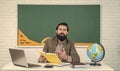 informal education. male student sit in school classroom on lesson with blackboard. pass the exam. learning the subject Royalty Free Stock Photo