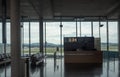 Information counter and black seats at terminal waiting area in Zurich Kloten airport on beautiful outdoor view background Royalty Free Stock Photo