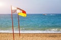 Information flags on the sea beach Royalty Free Stock Photo