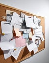 Information Overload on a Cluttered Office Bulletin Board Royalty Free Stock Photo