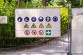 Information panel with forbidden and permissible signs at the construction site metal fence, closeup Royalty Free Stock Photo