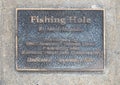 Information plaque for `Fishing Hole` by Mark Hopkins in Edmond, Oklahoma.