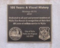 Information plaque for `100 Years: A Visual History` by artists Larry Enge and Charlotte Lindsey at Wylie Fire Station 3 in Texas.
