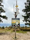 Information post on the peak of Babia Gora in Beskid Slaski, 1220 m above sea level. with a map and signs informing about various