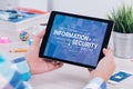 Information security concept on digital tablet pc in male hands Royalty Free Stock Photo