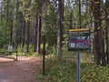 Information sign along hiking path of Grassi Lakes Trail in the Rocky Mountains informing about the wildlife corridor.