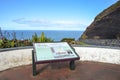 Information sign in Pico das Camarinhas viewpoint, Ponta Ferraria, Azores islands, Portugal. Blue Atlantic ocean and