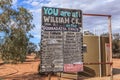 Information sign at William Creek Hotel showing distances to tourist places in the Australia