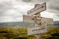 information and updates text engraved on old wooden signpost outdoors in nature Royalty Free Stock Photo