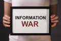 Information war, warfare word on paper. IW concept Royalty Free Stock Photo