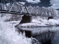 Infra red landscape image of  bridge over river Royalty Free Stock Photo