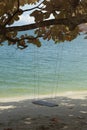 the single rope bench swing by the beach. Royalty Free Stock Photo