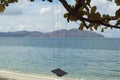 the single rope bench swing by the beach. Royalty Free Stock Photo