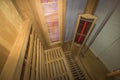 Infrared sauna interior close up view. Wooden walls and bench, ceramic heaters. Healthy lifestyle concept