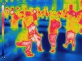 Infrared Thermal image of people at the city railway station on a cold winter day