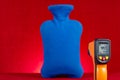 infrared thermometer shows the surface temperature of hot water bottle