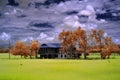 Infrared traditional wooden house in the middle of paddy field Royalty Free Stock Photo