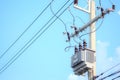 Electric pole and electric transformer on sky background. Royalty Free Stock Photo