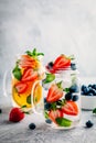 Infused detox water with blueberry, strawberry, orange and mint. Ice cold summer cocktail or lemonade. Royalty Free Stock Photo