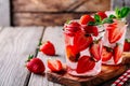 Detox water with strawberry and mint. Ice cold summer cocktail or lemonade in glass mason jar Royalty Free Stock Photo