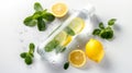 Infused water bottle with lemon slices and mint leaves, surrounded by fresh water droplets on a white surface