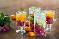 Infused water detox diet drinks of mix fruits on wood Royalty Free Stock Photo