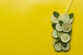 Infused water on a glass. Detox water mix of cucumber, lemon, lime and mint