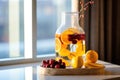 infused water jug with winter fruits on spa reception desk Royalty Free Stock Photo