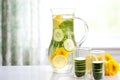 Infused Water With Lemon And Cucumber In A Glass Pitcher