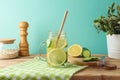 Infused water with lemon and cucumber on wooden table. Detox, diet, healthy eating or weight loss concept background Royalty Free Stock Photo