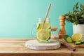 Infused water with lemon and cucumber on wooden table. Detox, diet, healthy eating or weight loss concept background Royalty Free Stock Photo