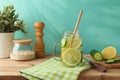 Infused water with lemon and cucumber on wooden table. Detox, diet, healthy eating or weight loss concept background Royalty Free Stock Photo