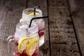 Infused Water with Lemon and Raspberry Healthy Detox Drink Cold Berry Fruit Lemonad in Glass Jars Wooden Background Close Up Royalty Free Stock Photo