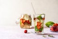 Infused water with strawberry and meloncella that is hybrid of cucumber and melon, thyme, mint. Copy space. Royalty Free Stock Photo