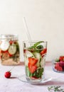 Infused water with strawberry and meloncella that is hybrid of cucumber and melon, thyme, mint. Copy space. Royalty Free Stock Photo